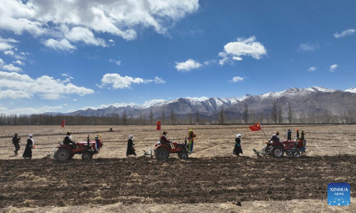 A drone photo taken on March 16, 2025 shows a ceremony marking the start of spring farming in Qangka Township, Lhunzhub County of Lhasa, southwest China's Xizang Autonomous Region. Ceremonies marking the start of spring farming were held across Xizang on Sunday. The ceremony holds great significance as it marks the beginning of a new year's farming season and serves as a prayer for favorable weather and bountiful harvests. It is considered an important ritual in the farming regions of Xizang. (Xinhua/Jigme Dorje)