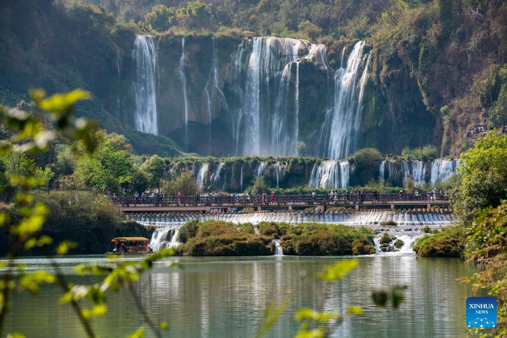 Tourists have fun at the scenic area of Jiulong Waterfalls in Luoping County, southwest China's Yunnan Province, March 10, 2025. (Photo: Xinhua)