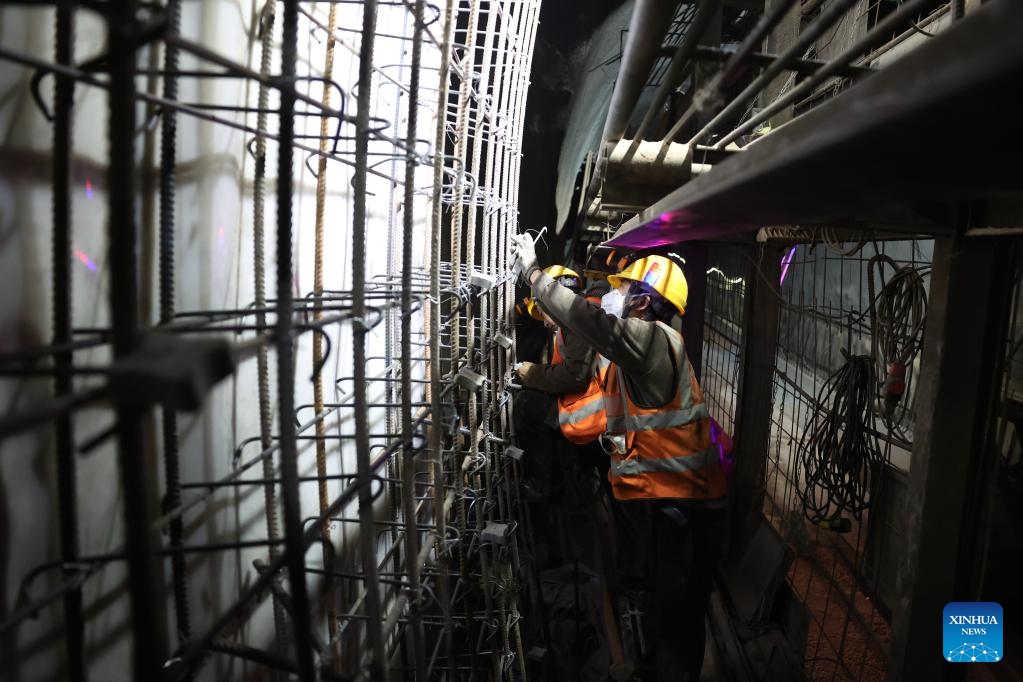 Staff members work on the construction site of the right track tunnel of the Huangjialing Tunnel in Linxia Hui Autonomous Prefecture, northwest China's Gansu Province, March 9, 2025. The right track tunnel of the Huangjialing Tunnel was drilled through on Sunday. The Huangjialing Tunnel, with a total length of 5,881 meters, is a key project of Lanzhou-Hezuo high-speed railway, a part of China's high-speed rail network that centers around eight main vertical lines linking the north and south and eight horizontal lines connecting the east and west. (Photo: Xinhua)