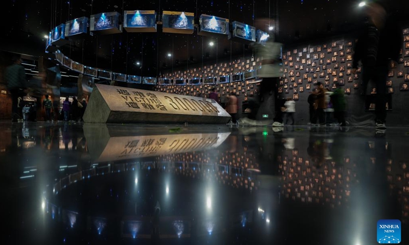 People visit the Memorial Hall of the Victims in Nanjing Massacre by Japanese Invaders, in Nanjing, east China's Jiangsu Province, March 11, 2025. A lights out mourning ceremony for four survivors of the Nanjing Massacre who passed away this year was held Tuesday in Nanjing. Two survivors of the Nanjing Massacre passed away on Feb. 15 this year, bringing the number of living registered survivors to 28, according to the Memorial Hall of the Victims in Nanjing Massacre by Japanese Invaders. (Photo: Xinhua)