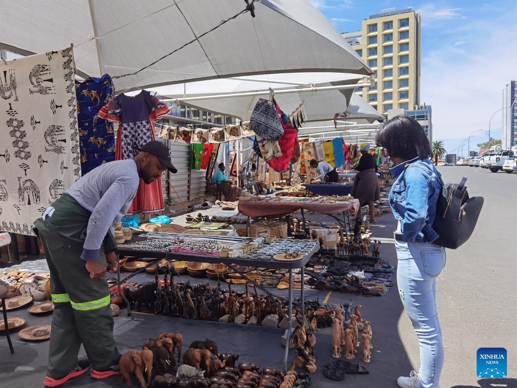 A woman visits a street art market in Windhoek, Namibia, on March 8, 2025. (Photo: Xinhua)
