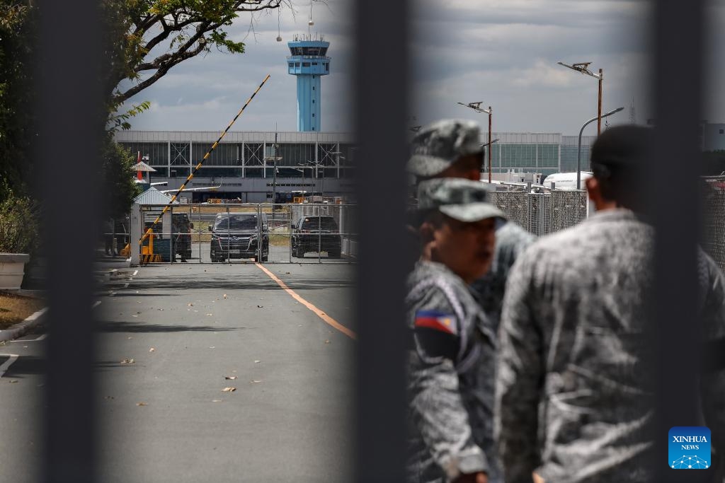 Soldiers gather to secure the area where former Philippine President Rodrigo Duterte is being held in the Villamor Airbase in Pasay City, Metro Manila, the Philippines, March 11, 2025. The Philippine Presidential Communications Office (PCO) issued a statement on Tuesday, confirming that former President Rodrigo Duterte was detained by police upon his return to Manila from abroad. (Photo: Xinhua)