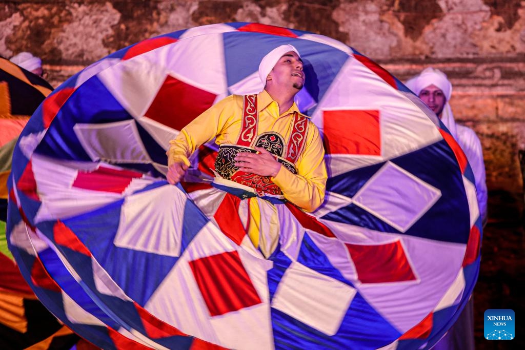 A dancer performs Tanoura, a traditional Egyptian folk dance, during the holy month of Ramadan at the Sultan Al-Ghuri complex in Cairo, Egypt, on March 12, 2025. (Photo: Xinhua)