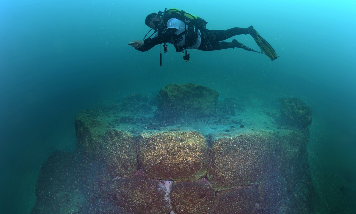 A man dives in the depths of Lake Van for research on March 13, 2025 in Van, Turkiye. As a result of the research carried out in the depths of Lake Van, 15 meters deep on the shore of Akdamar Island, a bastion-like structure and wall remains were identified. Photo: VCG