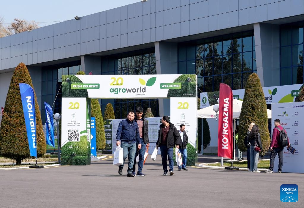 People walk out of the international exhibition AgroWorld Uzbekistan in Tashkent, the capital of Uzbekistan, March 11, 2025. The three-day exhibition, with exhibits covering a wide range of fields, including agricultural machinery and accessories, crop cultivation, animal husbandry, and poultry farming, opened here on Tuesday. (Photo: Xinhua)