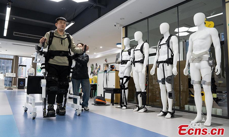 A disabled man slowly stands up with the help of robotic exoskeleton in Hangzhou City, Zhejiang Province, March 13, 2025. (Photo: China News Service/Wu Junyi)
