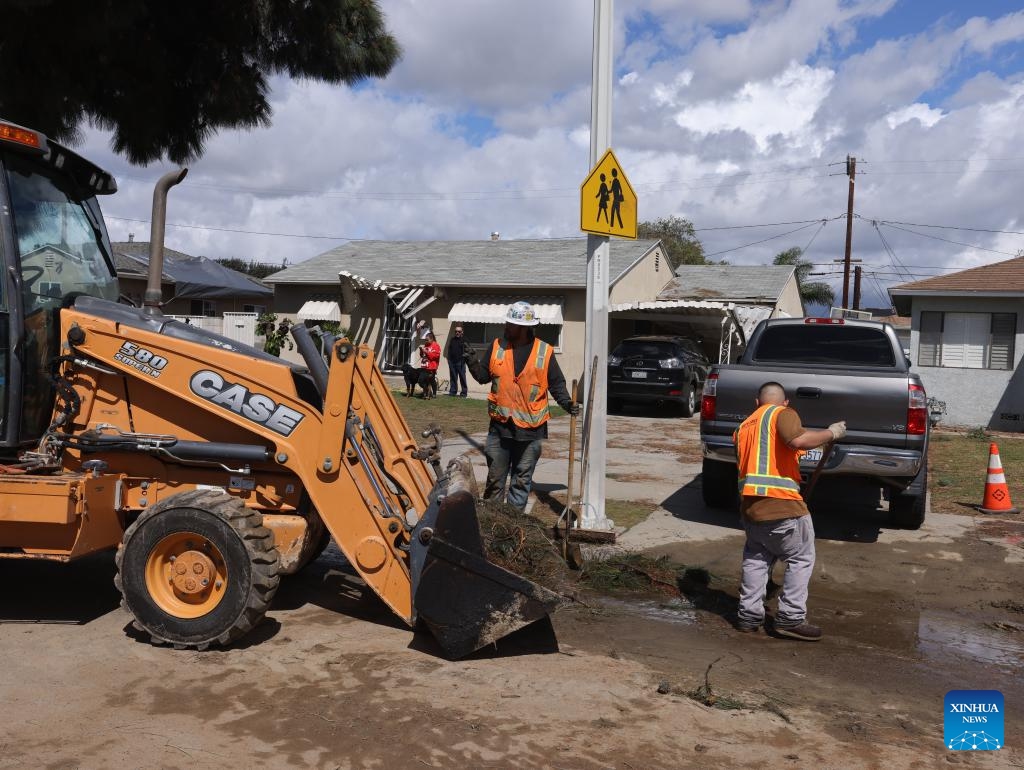 Workers remove debris after a tornado in Pico Rivera, Los Angeles, California, the United States, on March 13, 2025. A tornado ripped through Los Angeles County, Southern California, early Thursday morning, the U.S. National Weather Service (NWS) confirmed. The tornado caused exterior damage to homes and cars, and snapped multiple trees, said NWS. (Photo: Xinhua)