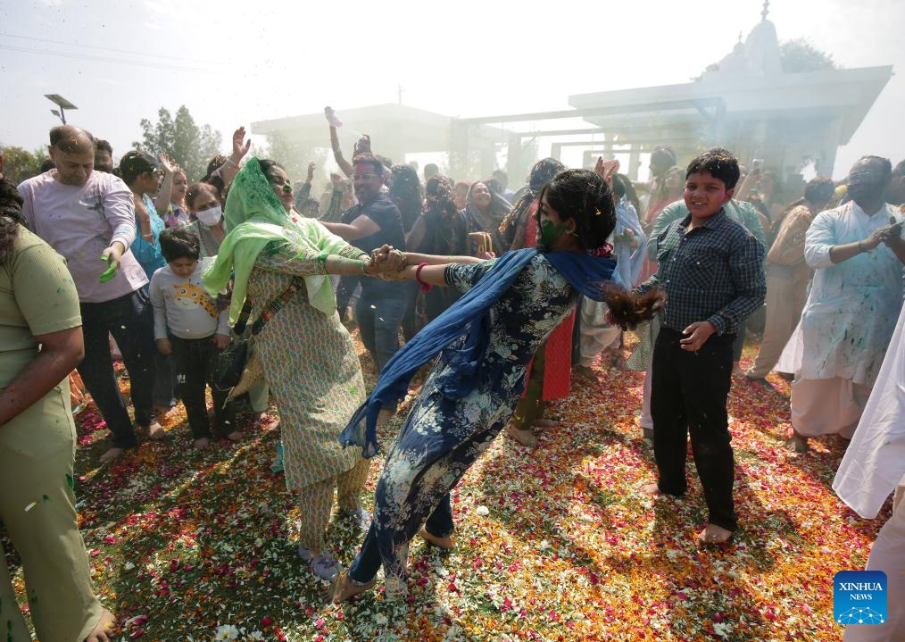 People smeared with colored powder celebrate the Holi Festival in Amritsar district of India's northern Punjab state, March 13, 2025. Holi, the festival of colors, marks the end of winter and the onset of the spring season. (Photo: Xinhua)