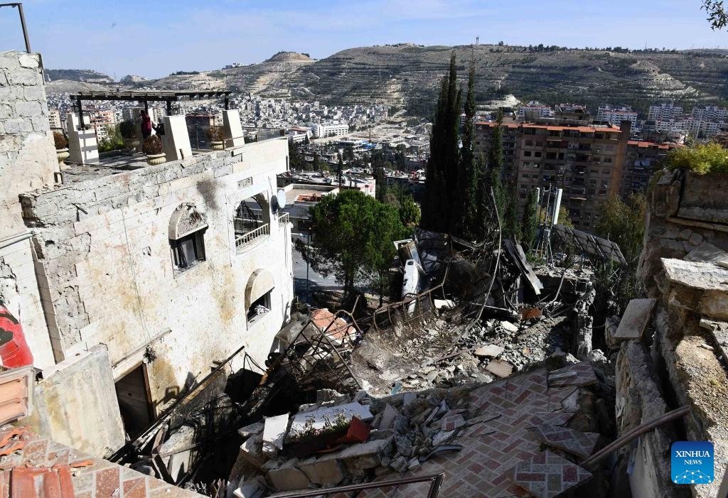 This photo taken on March 13, 2025 shows a damaged building after an Israeli airstrike in Damascus, Syria. An Israeli airstrike on Thursday targeted a residential building in the Mashrou' Dummar neighborhood northwest of the Syrian capital Damascus, killing one person, local media and a war monitoring group reported. According to Syria's state news agency SANA, the strike resulted in casualties, though the exact number of wounded remains unclear. (Photo: Xinhua)