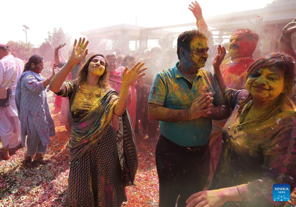 People smeared with colored powder celebrate the Holi Festival in Amritsar district of India's northern Punjab state, March 13, 2025. Holi, the festival of colors, marks the end of winter and the onset of the spring season. (Photo: Xinhua)