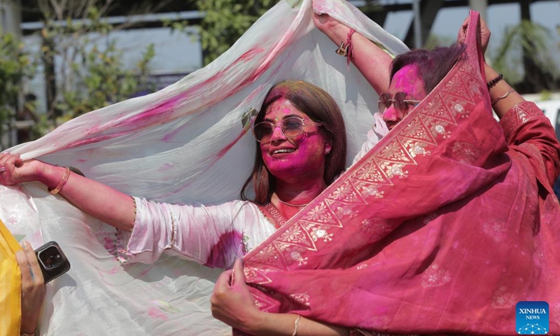People smeared with colored powder celebrate the Holi Festival in Amritsar district of India's northern Punjab state, March 13, 2025. Holi, the festival of colors, marks the end of winter and the onset of the spring season. (Photo: Xinhua)