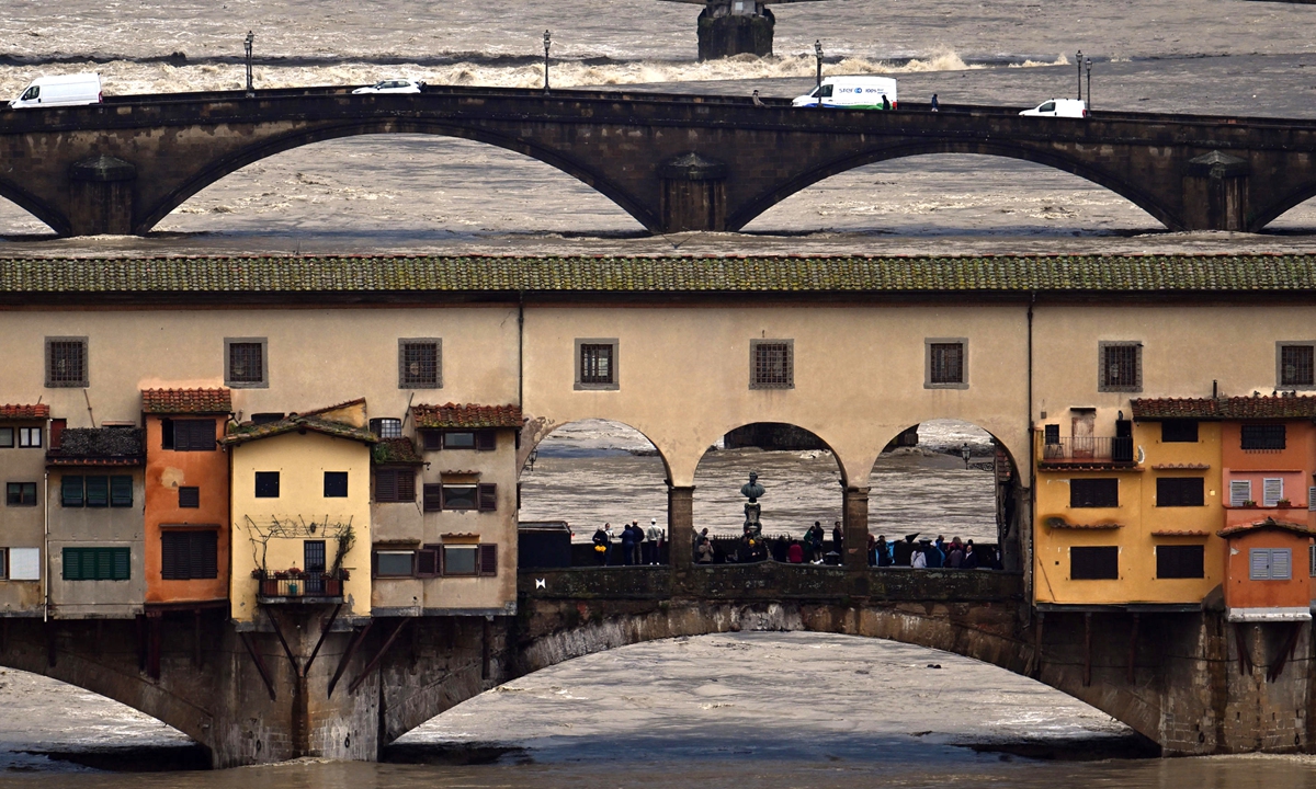 The swollen Arno river after heavy overnight rain, in Florence, Italy, 14 March 2025. Several rivers in the Tuscany and Emilia-Romagna regions were placed under alert levels for torrential rain and flooding. Photo: VCG