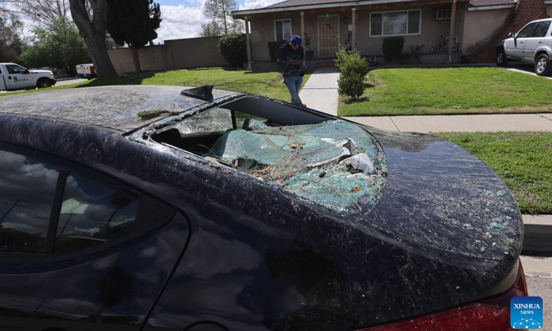 Photo taken on March 13, 2025 shows a car damaged by a tornado in Pico Rivera, Los Angeles, California, the United States. A tornado ripped through Los Angeles County, Southern California, early Thursday morning, the U.S. National Weather Service (NWS) confirmed. The tornado caused exterior damage to homes and cars, and snapped multiple trees, said NWS. (Photo: Xinhua)