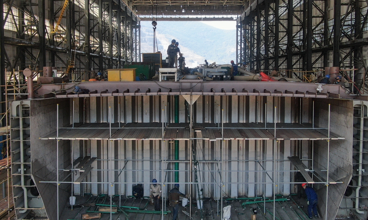 Workers construct a 135-meter stainless steel chemical tanker ordered by a Dutch company at Jiangxi New Jiangzhou Shipbuilding Heavy Industry Co in Ruichang, East China's Jiangxi Province, on March 17, 2025. As the largest shipbuilder in Jiangxi, the company has orders booked until 2028, of which 95 percent are from overseas customers. Photo: cnsphoto
