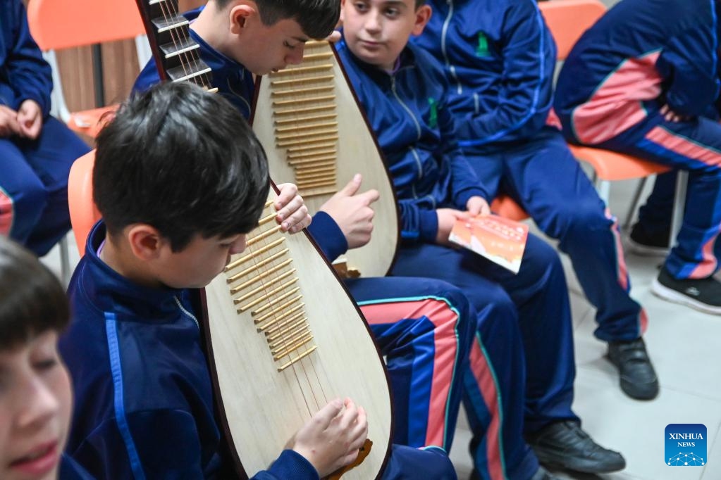 Students learn to play pipa during a pipa lesson in Qormi, Malta, on March 17, 2025. A groundbreaking initiative to introduce Chinese music to Maltese youth, featuring lessons of pipa, a traditional Chinese pear-shaped stringed instrument, was launched on Monday at St Ignatius College Handaq Middle School in Malta. (Photo: Xinhua)