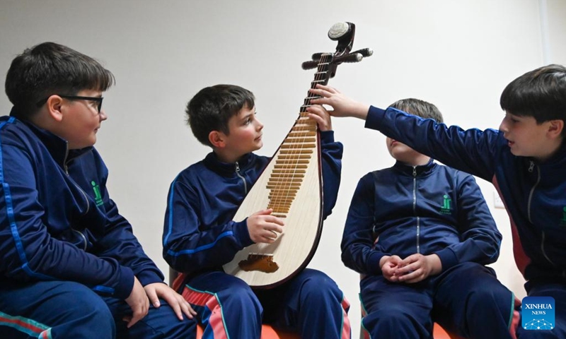 Students learn to play pipa during a pipa lesson in Qormi, Malta, on March 17, 2025. A groundbreaking initiative to introduce Chinese music to Maltese youth, featuring lessons of pipa, a traditional Chinese pear-shaped stringed instrument, was launched on Monday at St Ignatius College Handaq Middle School in Malta. (Photo: Xinhua)