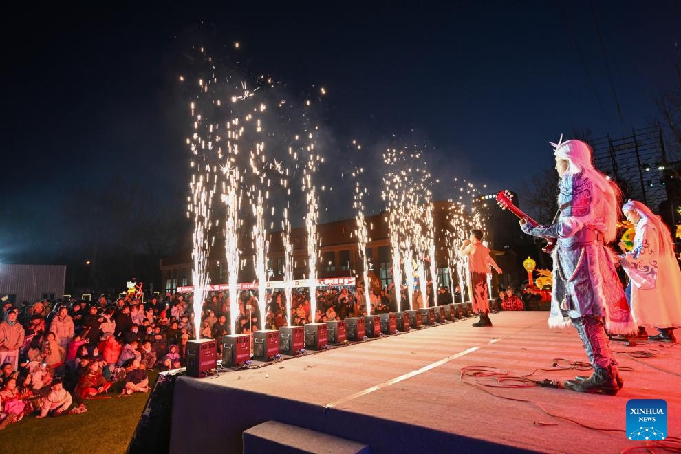 A band performs at Nezha town in north China's Tianjin, March 16, 2025. Recently, Nezha town in Tianjin hosts a cultural week event, featuring a range of activities centered around the theme of Nezha and other traditional cultural elements. The event included performances, interactive parades, and lantern night tours, offering visitors an immersive cultural experience. Originally the site of the Tianjin Bohai Radio Factory, Nezha town has undergone a transformation as part of Tianjin's urban renewal initiatives. (Photo: Xinhua)