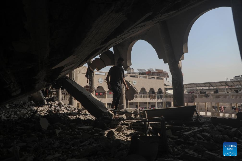 A Palestinian checks the damage of a building in the Shuja'iyya neighborhood, east of Gaza City, on March 18, 2025. The Palestinian death toll from Israeli airstrikes across the enclave early Tuesday has risen to 413, Gaza health authorities reported, adding women and children were among those killed. (Photo: Xinhua)
