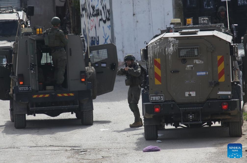 Israeli soldiers are seen during a military operation in the Askar al-Jadid camp, east of Nablus in the West Bank, on March 18, 2025. (Photo: Xinhua)