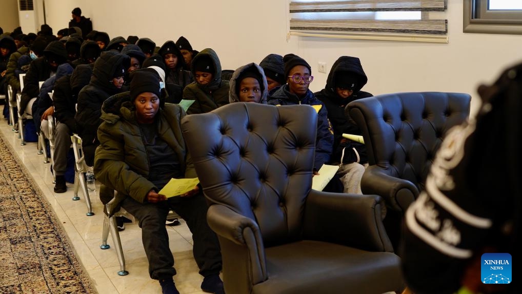 Migrants of Nigerian nationality wait for deportation at the Deportation Office of the Illegal Migration Control Department in Tripoli, Libya, on March 18, 2025. Libya on Tuesday deported 177 Nigerian migrants, mostly women, as part of a voluntary repatriation program, the country's Illegal Migration Control Department said. (Photo: Xinhua)