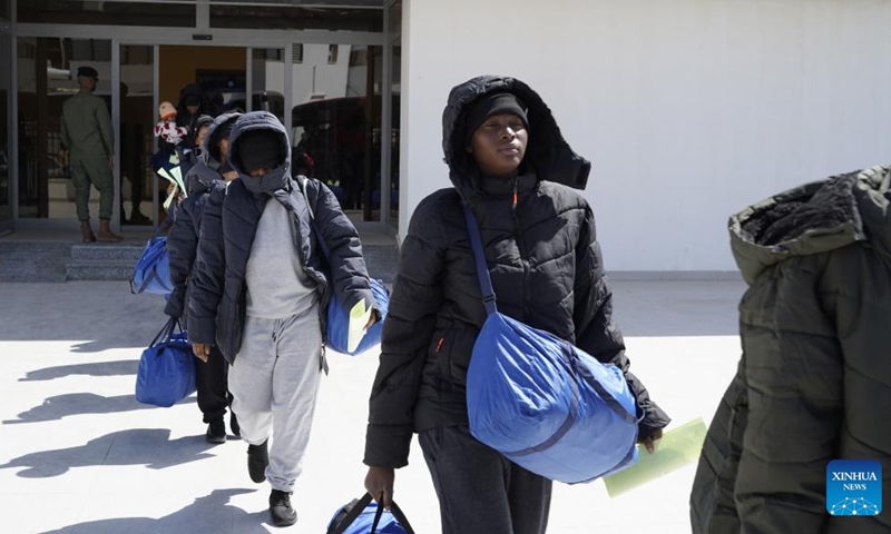 Migrants of Nigerian nationality line up to get on a bus in Tripoli, Libya, on March 18, 2025. Libya on Tuesday deported 177 Nigerian migrants, mostly women, as part of a voluntary repatriation program, the country's Illegal Migration Control Department said. (Photo: Xinhua)