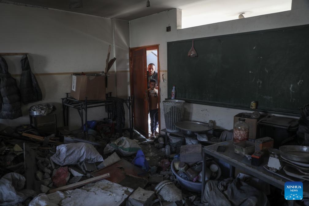 People check the damage of a building in the Shuja'iyya neighborhood, east of Gaza City, on March 18, 2025. The Palestinian death toll from Israeli airstrikes across the enclave early Tuesday has risen to 413, Gaza health authorities reported, adding women and children were among those killed. (Photo: Xinhua)