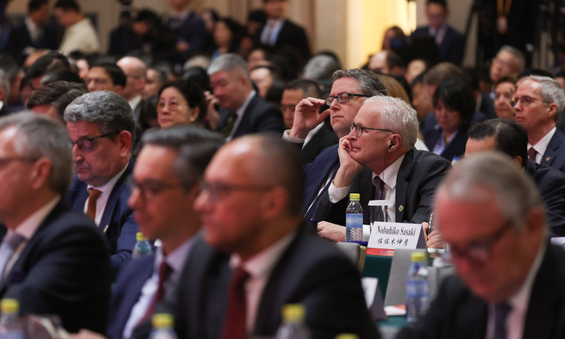 Guests participate in a symposium on macro policy and economic growth at the 2025 China Development Forum (CDF) in Beijing on March 23, 2025.