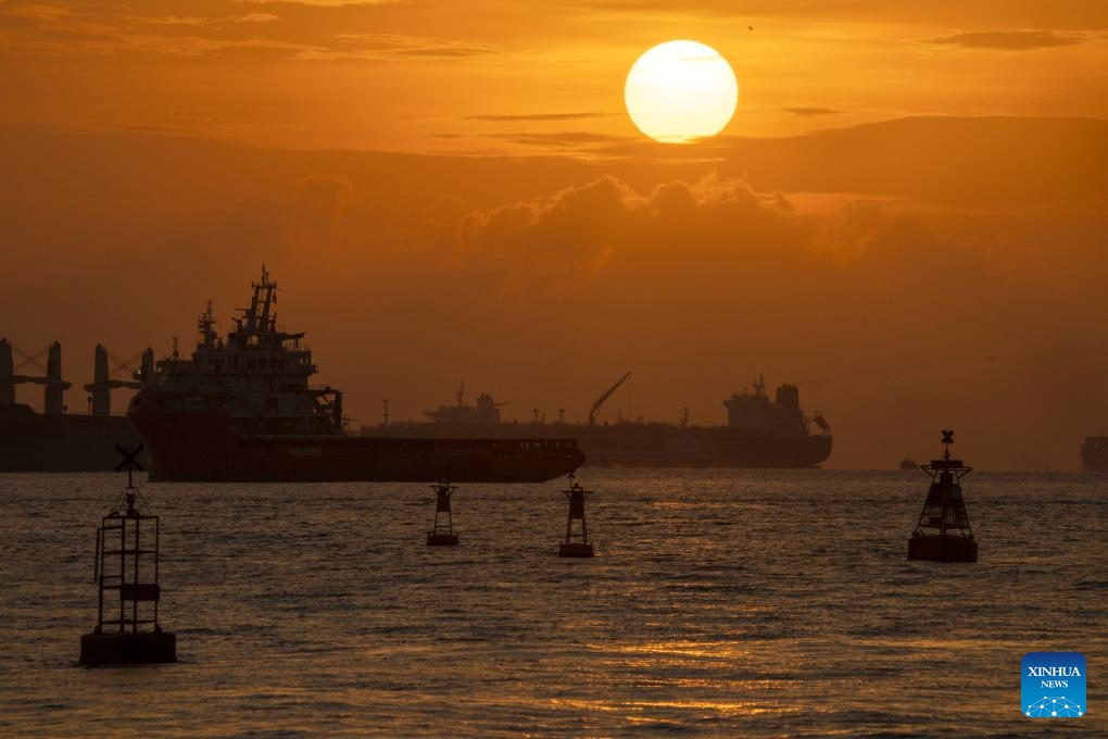 The sun rises over the Singapore Strait on March 18, 2025. (Photo: Xinhua)