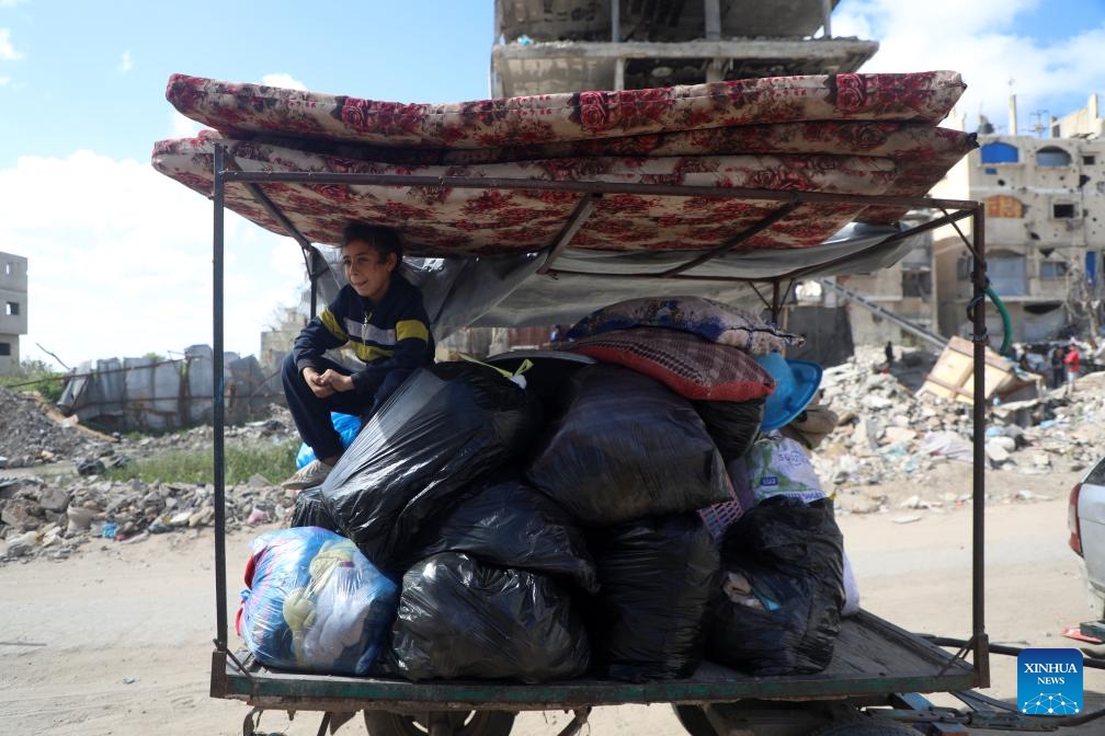 Palestinians flee from the Shuja'iyya neighborhood, east of Gaza City, on March 19, 2025. Tens of Palestinian families fled their homes in various areas of Gaza on Wednesday after the Israeli army issued new evacuation orders, warning of intensified military operations. (Photo: Xinhua)
