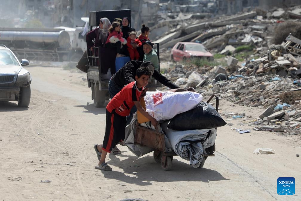 Palestinians flee from the Shuja'iyya neighborhood, east of Gaza City, on March 19, 2025. Tens of Palestinian families fled their homes in various areas of Gaza on Wednesday after the Israeli army issued new evacuation orders, warning of intensified military operations. (Photo: Xinhua)