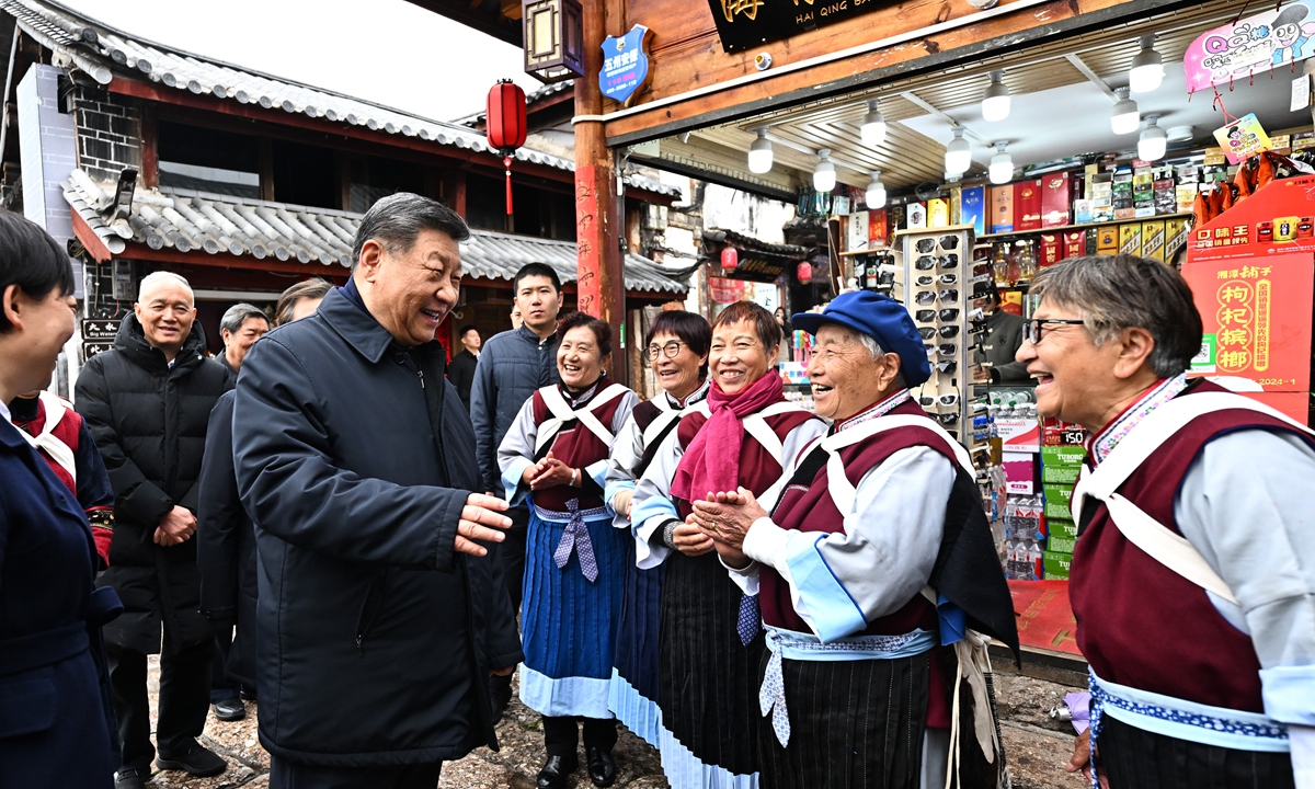 Xi Jinping, general secretary of the Communist Party of China Central Committee, talks with local residents while inspecting the Old Town of Lijiang, Southwest China's Yunnan Province, on March 19, 2025. Photo: Xinhua