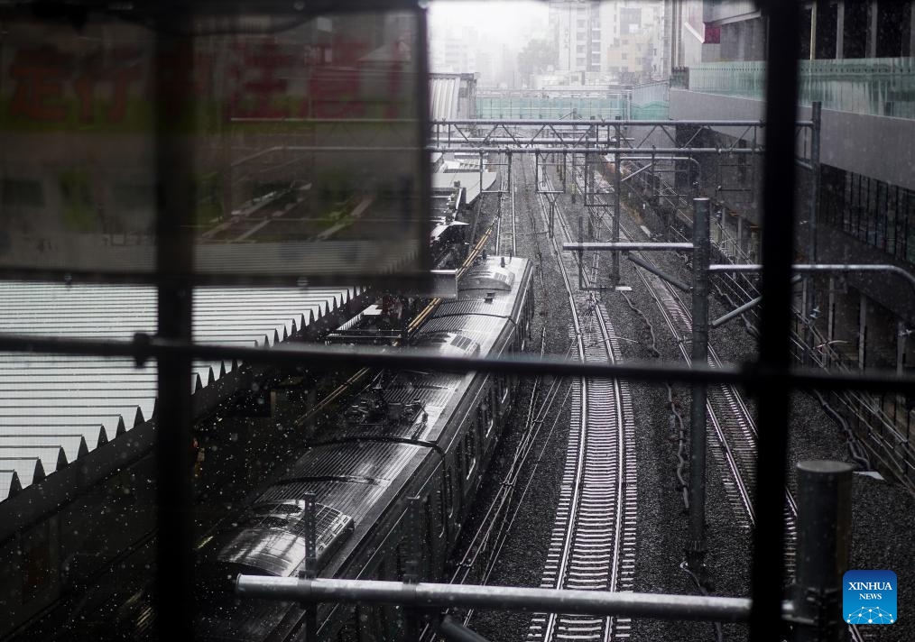 A tram is pictured at the Shibuya Station in Tokyo, Japan, March 19, 2025. Affected by cold air, Tokyo ushered in heavy snow on Wednesday. (Photo: Xinhua)