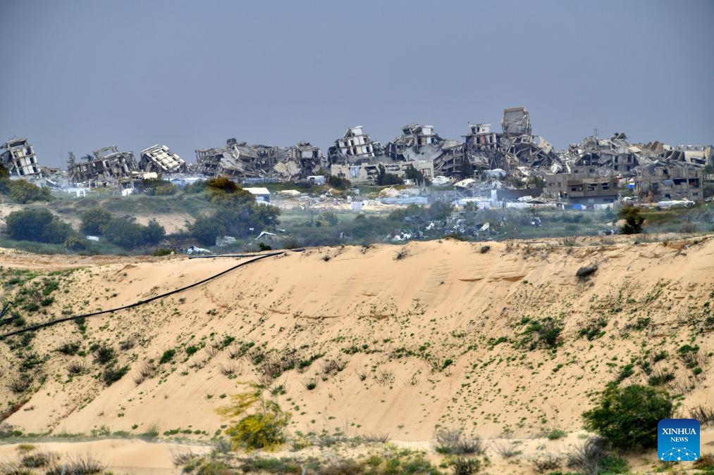 Photo taken on March 20, 2025 shows destroyed buildings in Gaza, as seen from southern Israeli border with Gaza. The Israeli military said on Thursday its troops were expanding their ground operation in southern Gaza, advancing into the Shabura refugee camp in Rafah city. (Photo: Xinhua)