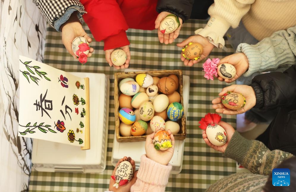 Children show colorful eggs they paint at a kindergarten in Qianyuan Town of Huzhou City, east China's Zhejiang Province, March 20, 2025. Spring Equinox, or Chunfen in Chinese, the fourth solar term in the Chinese lunar calendar, falls on March 20 this year. (Photo: Xinhua)