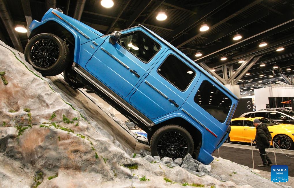 A man visits the 2025 Vancouver Auto Show at the Vancouver Convention Centre in Vancouver, British Columbia, Canada, March 19, 2025. Featuring a diverse range of vehicles, from luxury supercars to eco-friendly electric and hybrid models, the annual five-day auto show kicked off here on Wednesday. (Photo: Xinhua)