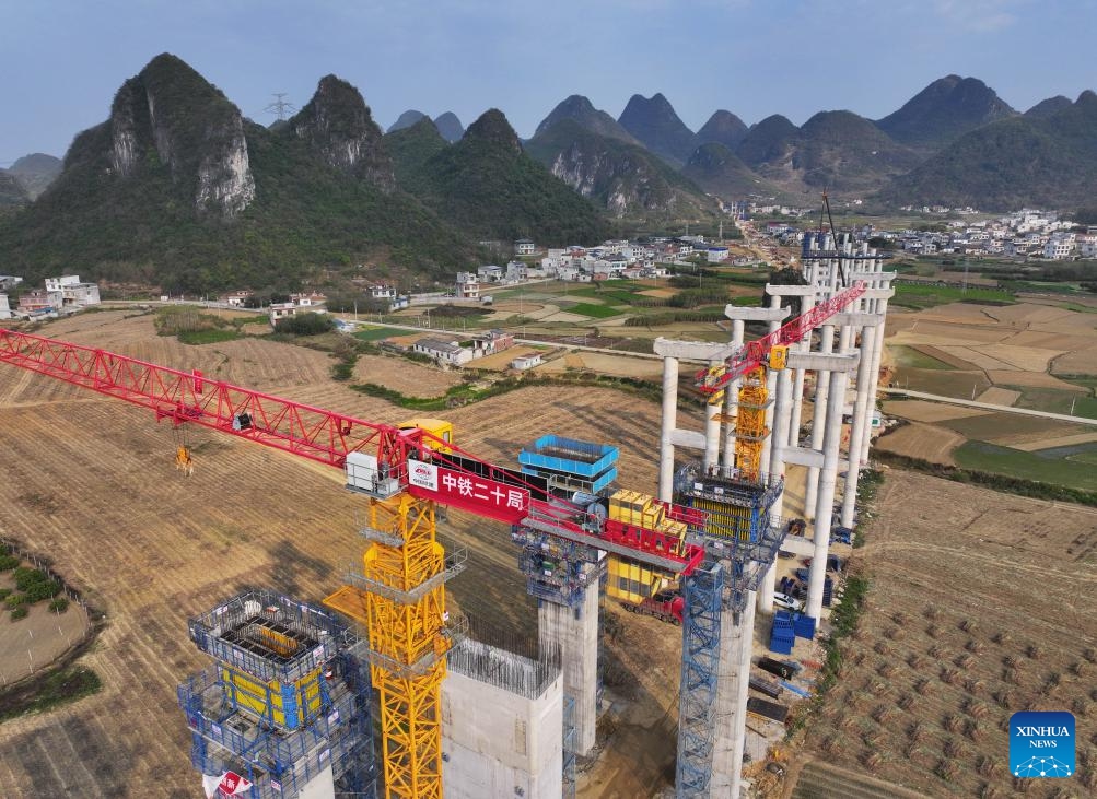 An aerial drone photo taken on March 20, 2025 shows the construction site of an expressway linking Yufeng and Yizhou in south China's Guangxi Zhuang Autonomous Region. Workers of China Railway 20th Bureau Group Co., Ltd. have recently speeded up the construction of the expressway linking Yufeng and Yizhou in Guangxi. (Photo: Xinhua)