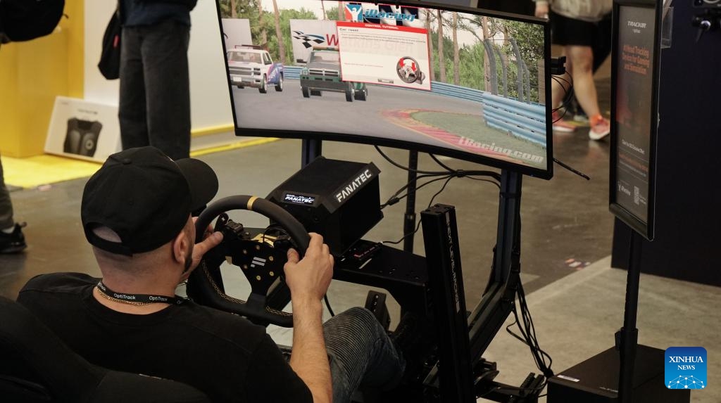 A visitor plays a racing game during the 2025 Game Developers Conference Expo (GDC Expo) in San Francisco, the United States, March 19, 2025. The 2025 GDC Expo kicked off in San Francisco on Wednesday. (Photo: Xinhua)