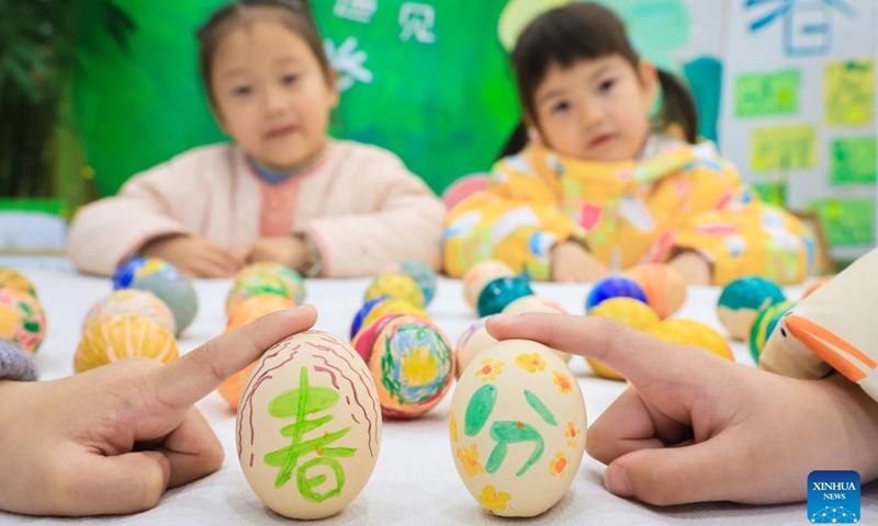 Children try to stand eggs at a kindergarten in Nanjing, east China's Jiangsu Province, March 20, 2025. Spring Equinox, or Chunfen in Chinese, the fourth solar term in the Chinese lunar calendar, falls on March 20 this year. (Photo: Xinhua)