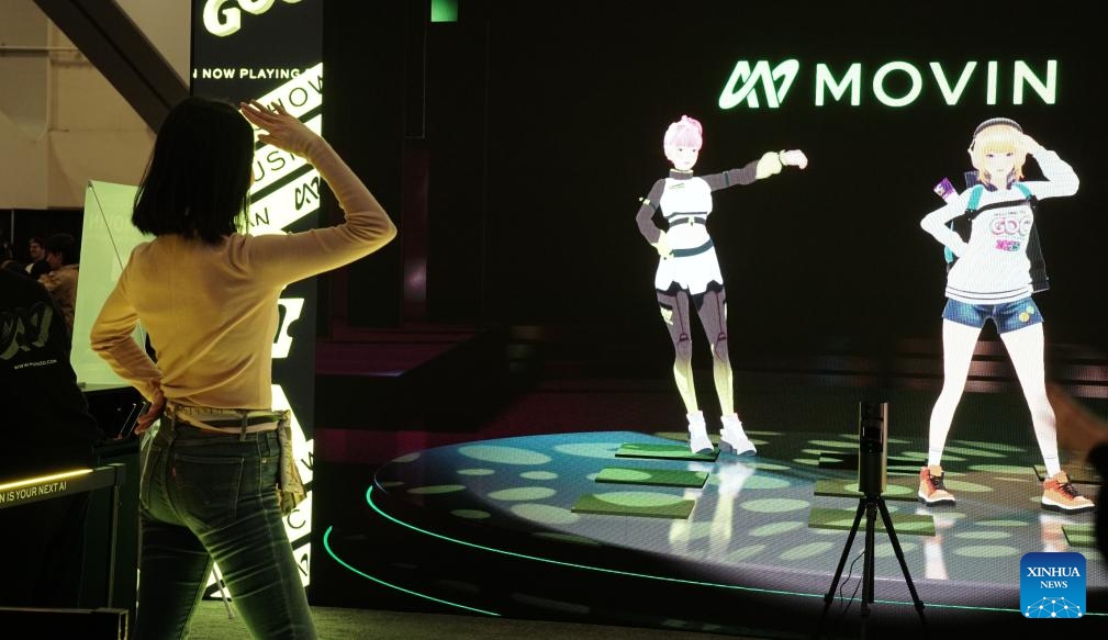 A visitor tries a motion tracking dancing device during the 2025 Game Developers Conference Expo (GDC Expo) in San Francisco, the United States, March 19, 2025. The 2025 GDC Expo kicked off in San Francisco on Wednesday. (Photo: Xinhua)