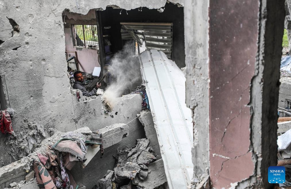 A Palestinian man is seen in a destroyed building after an Israeli airstrike in the northern Gaza Strip town of Beit Lahia, on March 20, 2025. The Israeli military said on Thursday its forces had begun ground operations in northern Gaza, while Hamas' armed wing claimed responsibility for rocket attacks on central Israel, including Tel Aviv, escalating hostilities as a weeks-long ceasefire collapses. Israeli troops began what the military described as ground activity overnight in the Beit Lahia area of northern Gaza, near the coastal border. (Photo: Xinhua)