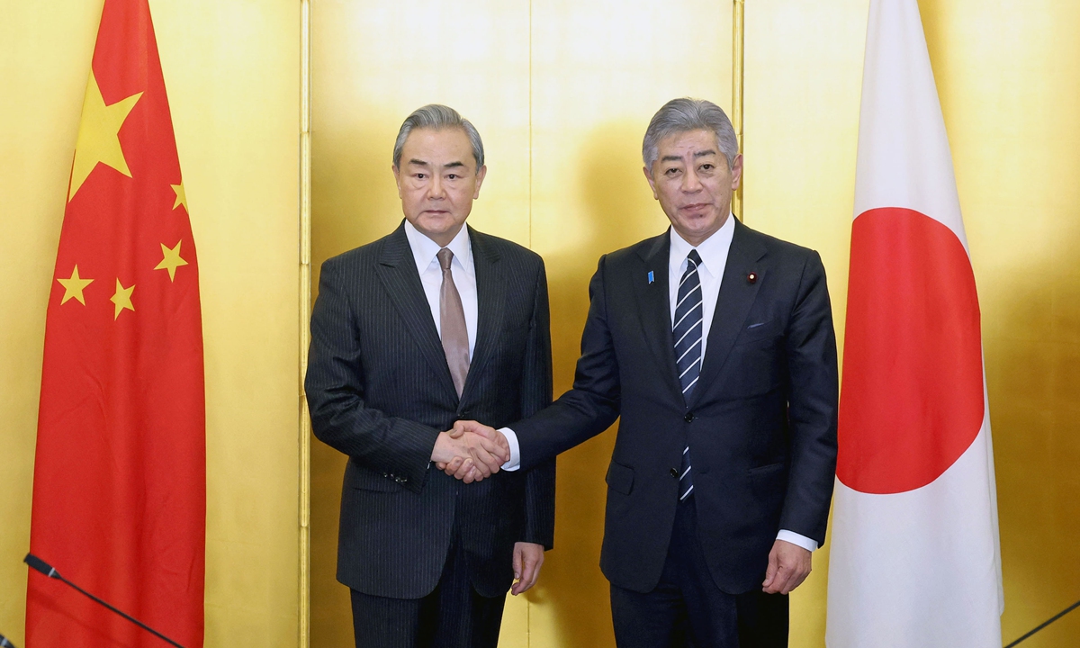 Chinese Foreign Minister Wang Yi, also a member of the Political Bureau of the Communist Party of China Central Committee, meets with Japanese Foreign Minister Takeshi Iwaya in Tokyo, Japan, on March 22, 2025. Photo: VCG