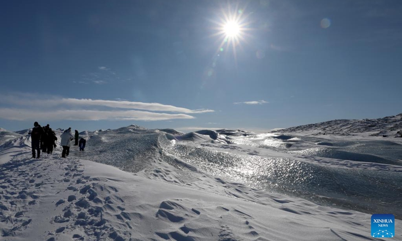 People walk on ice sheets near Kangerlussuaq, Greenland, an autonomous territory of Denmark, March 21, 2025. Photo: Xinhua