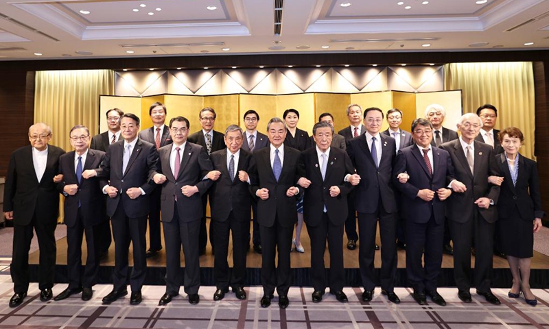 Wang Yi, a member of the Political Bureau of the Communist Party of China (CPC) Central Committee and director of the Office of the Foreign Affairs Commission of the CPC Central Committee, meets with representatives from seven Japan-China friendship groups in Tokyo, Japan, March 23, 2025. Attending the meeting were Hiroshi Moriyama, chairman of the Japan-China Friendship Parliamentarians' Union and secretary-general of Japan's ruling Liberal Democratic Party, President of the Japanese Association for the Promotion of International Trade Yohei Kono, as well as leaders of other friendship groups. Photo: Xinhua