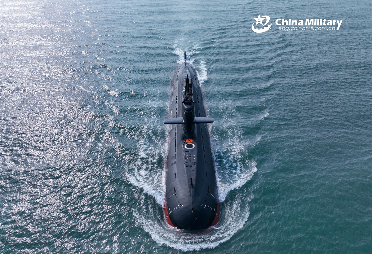 A submarine attached to a submarine flotilla with the navy under the Chinese PLA Northern Theater Command steams towards the designated area during a recent maritime training exercise. (eng.chinamil.com.cn/Photo by Zhang Nan)