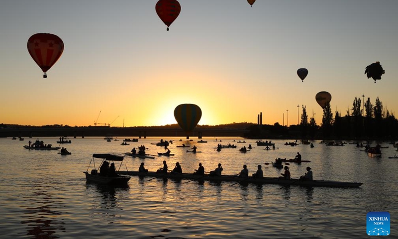 Hot air balloons fly over the Lake Burley Griffin during the annual Canberra Balloon Spectacular in Canberra, Australia, March 23, 2025. Photo: Xinhua