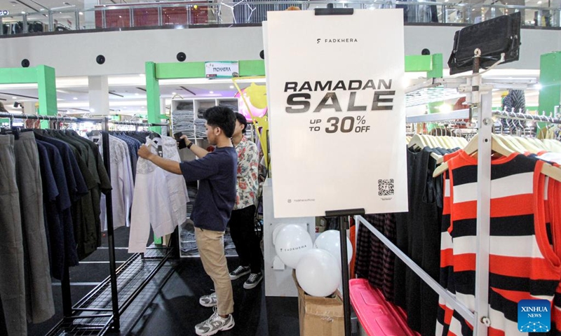 A man shops during sales offering discounts ahead of holidays of Eid al-Fitr at Mall Solo Paragon in Surakarta, Central Java, Indonesia, March 22, 2025. Photo: Xinhua