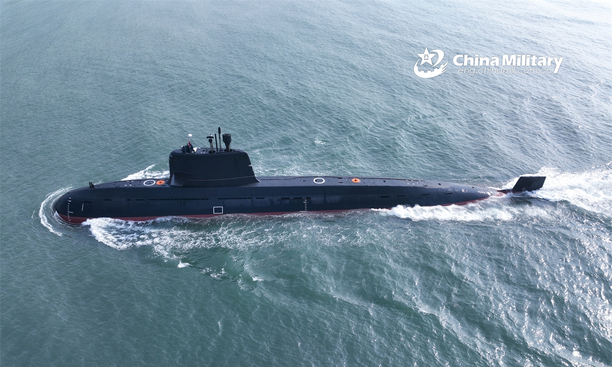 A submarine attached to a submarine flotilla with the navy under the Chinese PLA Northern Theater Command steams towards the designated area during a recent maritime training exercise. (eng.chinamil.com.cn/Photo by Zhang Nan)