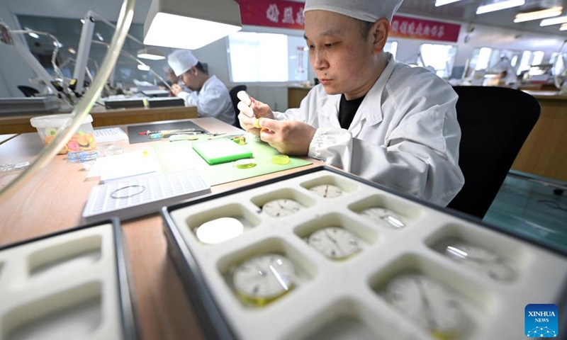 Staff members assemble watches at a workshop of the watch manufacturer SEA-GULL in north China's Tianjin, March 24, 2025. SEA-GULL, a watch manufacturer based in north China's Tianjin, celebrated the 70th anniversary of New China's first domestic watch with various activities on Monday. In 1955, a watch was successfully developed in Tianjin, marking SEA-GULL as the birthplace of the nation's pioneering timepiece. After seven decades of research and development efforts, the company has mastered advanced watchmaking technologies with independent intellectual property rights. (Photo: Xinhua)
