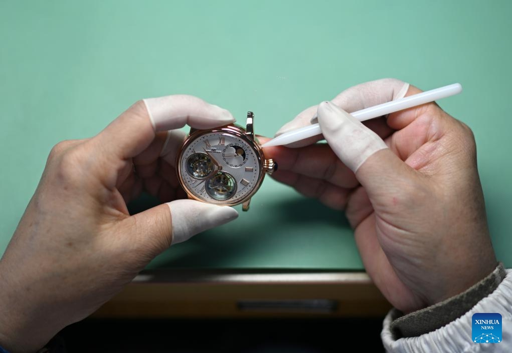 A staff member tests a watch at a workshop of the watch manufacturer SEA-GULL in north China's Tianjin, March 24, 2025. SEA-GULL, a watch manufacturer based in north China's Tianjin, celebrated the 70th anniversary of New China's first domestic watch with various activities on Monday. In 1955, a watch was successfully developed in Tianjin, marking SEA-GULL as the birthplace of the nation's pioneering timepiece. After seven decades of research and development efforts, the company has mastered advanced watchmaking technologies with independent intellectual property rights. (Photo: Xinhua)