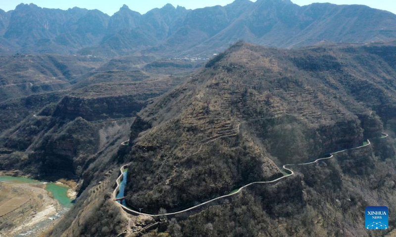 An aerial drone photo taken on March 18, 2025 shows a section of the Hongqi Canal in Pingshun County, north China's Shanxi Province. The Hongqi Canal, an irrigation project built on the steep Taihang Mountains, is dubbed the 